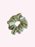 Green checkered scrunchie on a white background